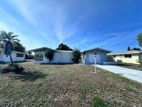 Building Photo - ****TWO WEEK FREE**** Charming 2-Bedroom Ranch in Cape Coral’s Bimini Basin Neighborhood
