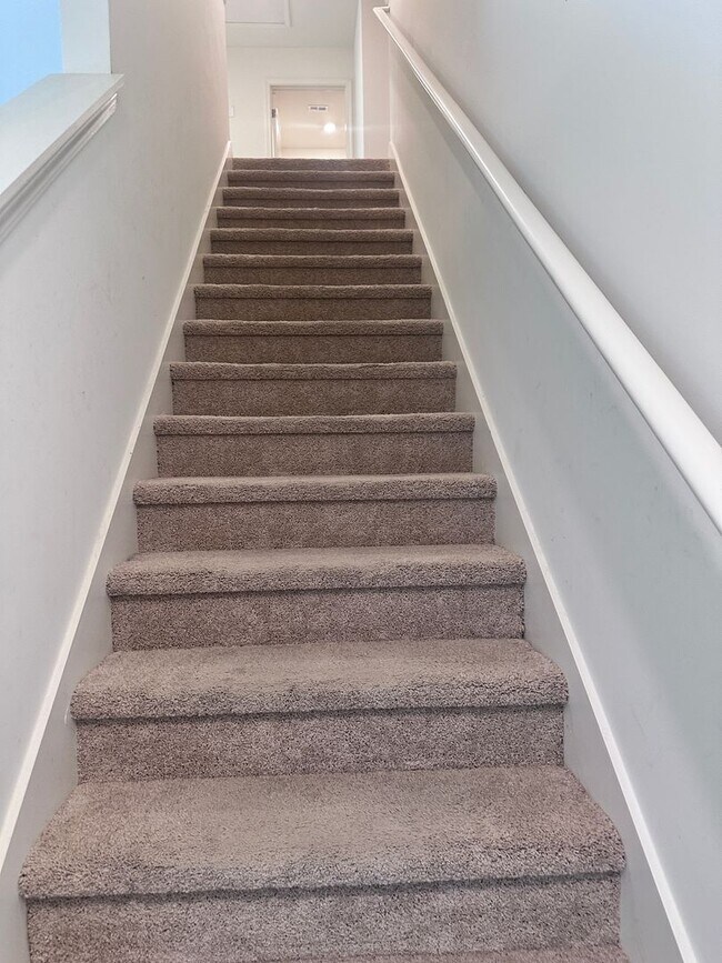 Building Photo - efficient two-level home provides a large living room, 4 very spacious bedrooms, and 2.5 bathrooms