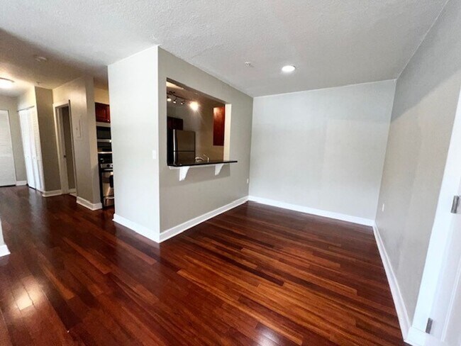 Building Photo - MOVE IN NOW!! Gated community Miriada! 1st floor 1X1.5 bath condo near pool area!!! Laminate wood...