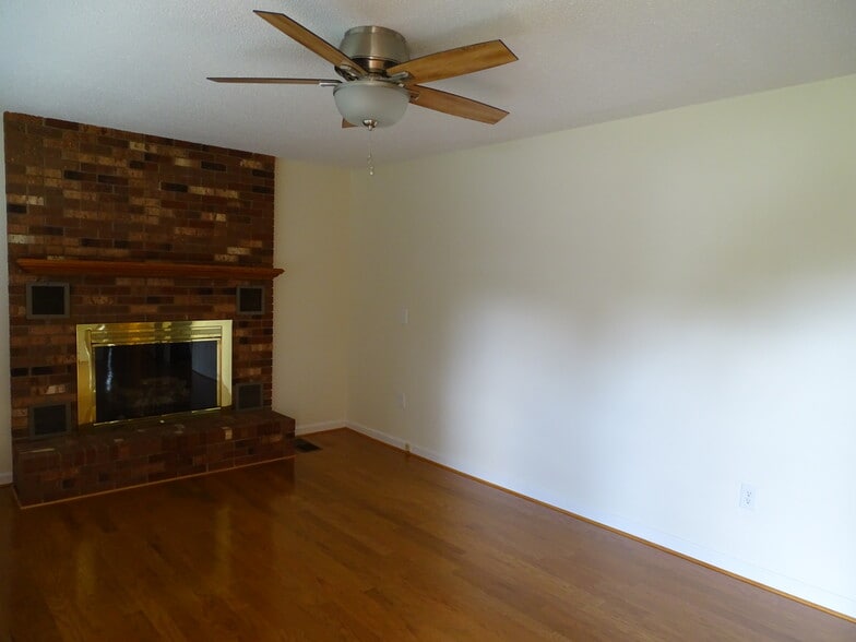 Living area has gas logs and lots of natural light. - 5694 Claridge Dr