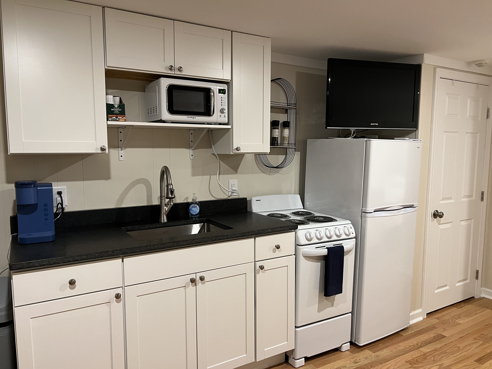 Kitchen includes Keurig, fridge/freezer, and most things you need to make your meals! - 78 E Grand Ave