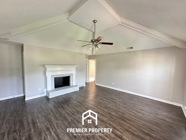 Building Photo - Charming 3BR/2BA Near Southwind | High Vaulted Ceilings, Hardwood Floors & Fireplace