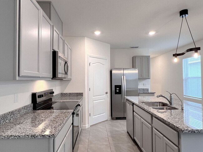 Building Photo - Four-Bedroom Home with Modern Finishes & Open Layout