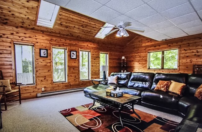 Spacious family room with multiple windows - 808 Pony Ln