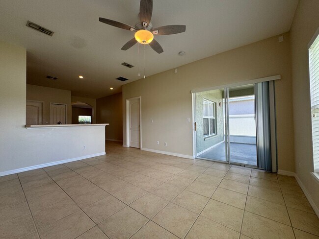 Building Photo - Beautiful 3/2 home near Lake Nona ~ Fenced In Yard ~ LVP & Tile Flooring ~ Community Pool!