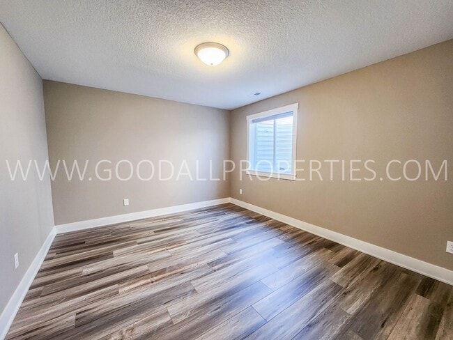 Building Photo - Spacious Waukee Ranch | 4 Bedrooms | 3-Car Garage | Finished Basement