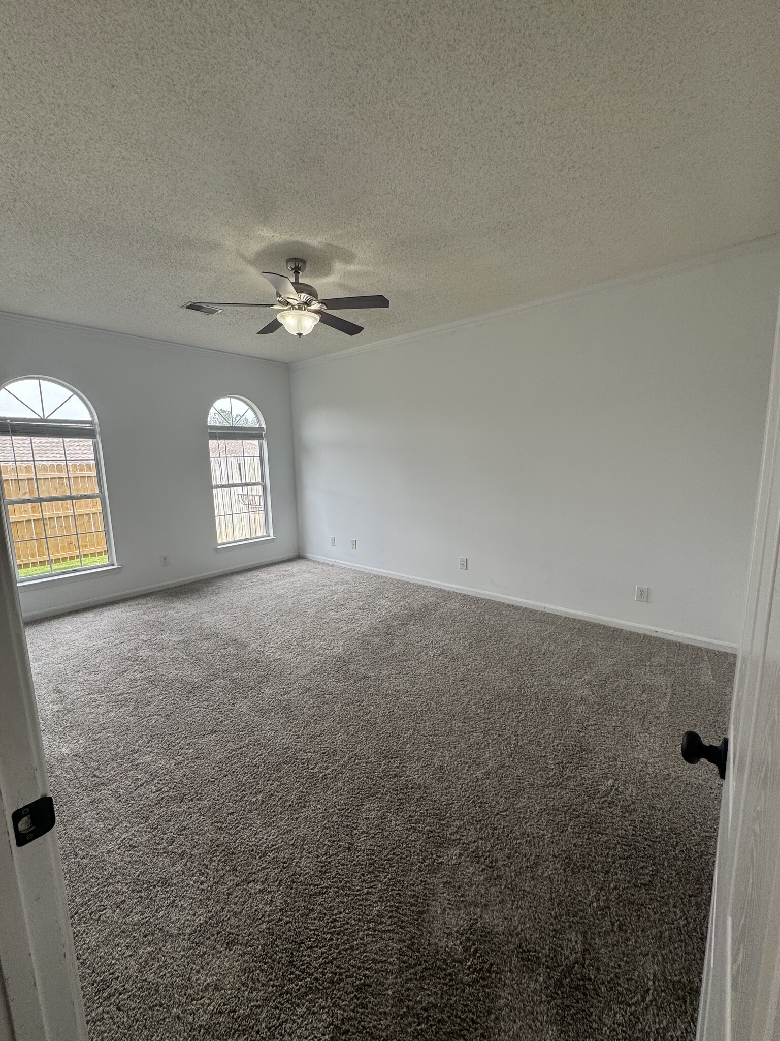 Master bedroom with view of backyard. - 1701 Water Oak Dr