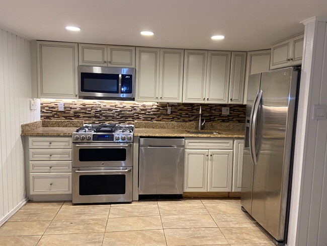 Kitchen with Dishwasher, Stove, Microwave, Stainless Fridge - 112 3rd St NE