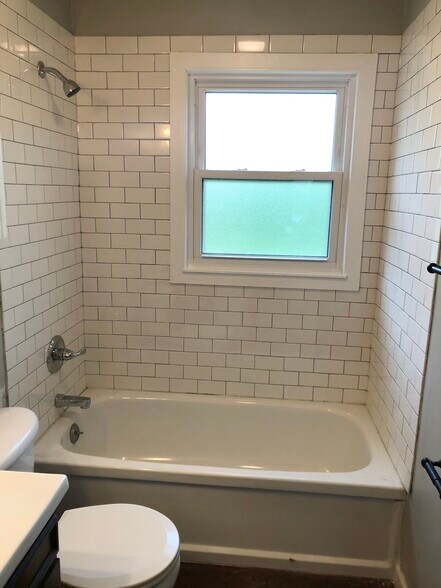 updated bath- new tile & windows - 1824 Miller Dr