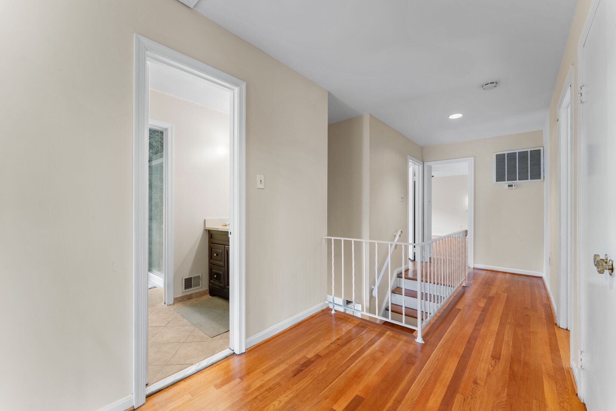 Stairs ascend to upper floor hallway with hardwood flrs - 9 Snug Hill Ct