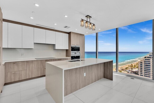 Building Photo - Stunning High-Rise Condo with Ocean Views | Prime Beach Location