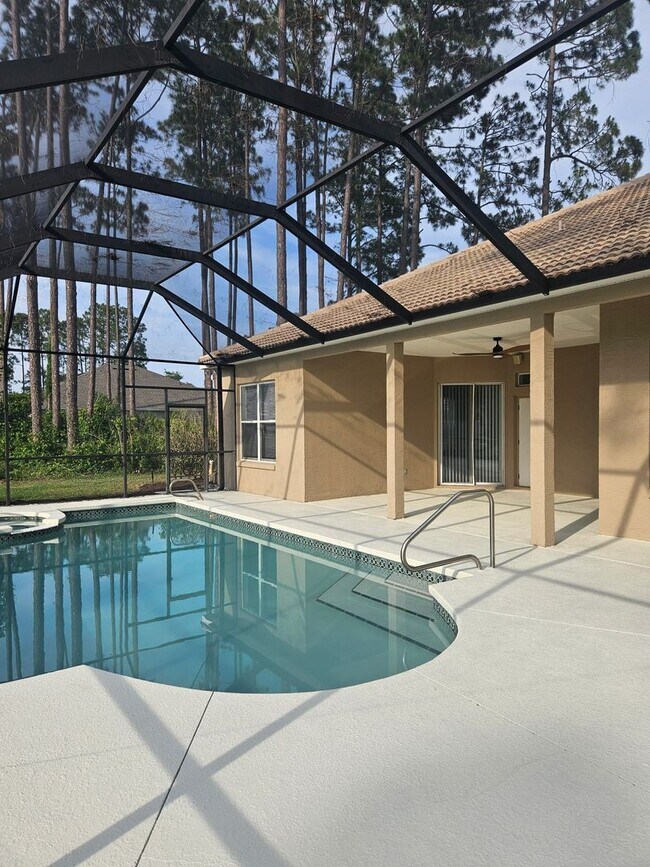 Building Photo - 4 BEDROOM 3 FULL BATH HOME WITH A SCREENED IN POOL IN THE BEAUTIFUL PALM COAST