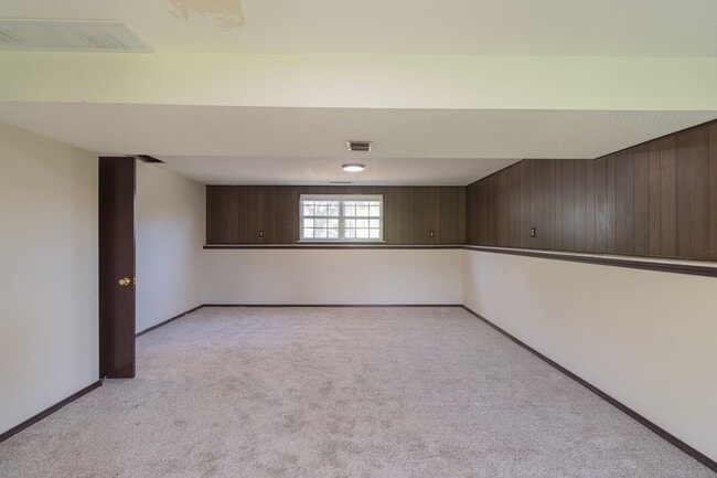 Building Photo - Charming 3BR Home-Screened Porch, Private Garage & Massive Backyard