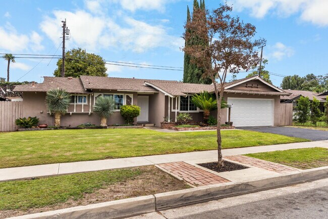 Building Photo - Charming Updated Home With Drive-Through Garage Access