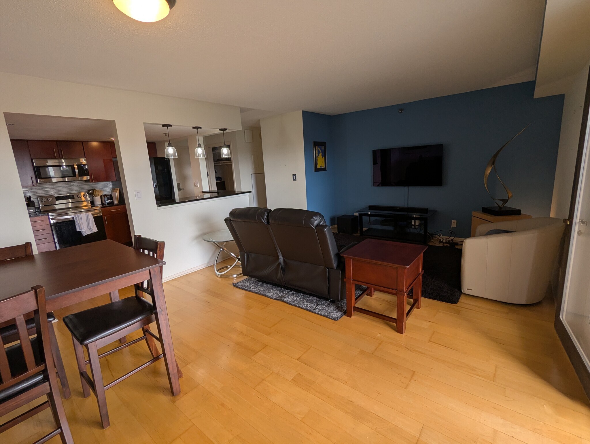 Large living room area with sound system - 110 1st Ave NE