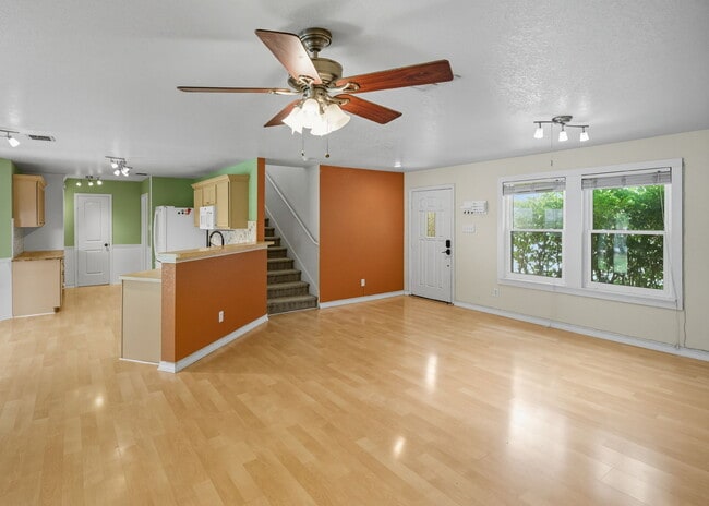 Building Photo - Incredible value with a **washer, dryer, refrigerator, shed, and a covered backyard with a dog run!