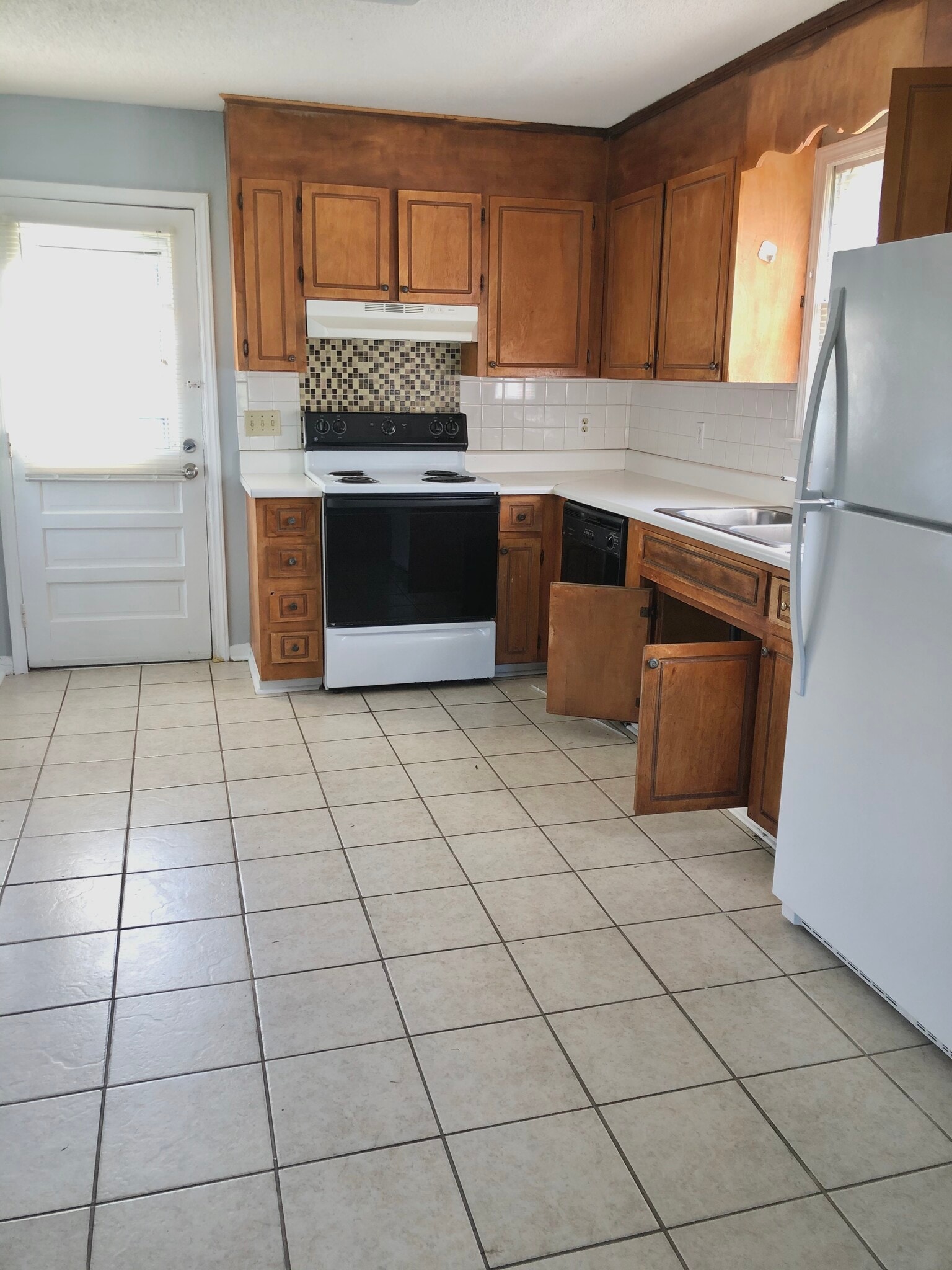 Kitchen and door that leads to backyard - 108 Hunter Dr
