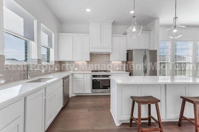 Building Photo - Live Elevated in the Heart of Viridian – S...