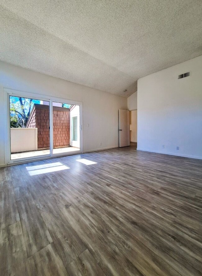 Building Photo - Spacious Two-Story 3bd Townhouse With Private Patios, Balcony, & Garage