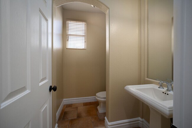 Separate powder room for your guests privacy - 2850 Bronzino Ct