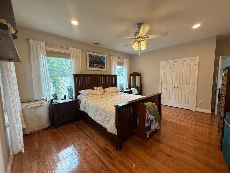 Master bedroom with ceiling fan and lots of light - 5715 7th St N