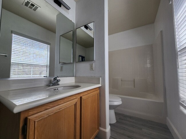 Building Photo - Sleek 2 story home with tile in most living areas and upgraded kitchen.