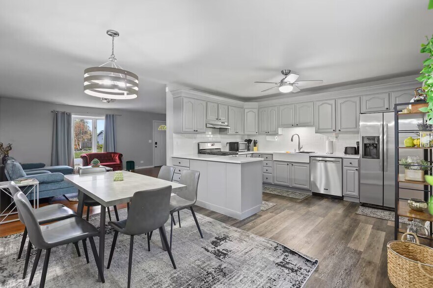 Dining area with fully stocked kitchen - 1002 Juniper Ln