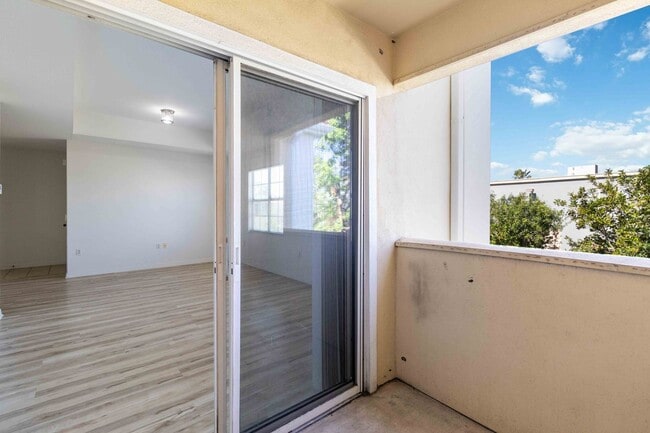 Building Photo - Spacious 1-Bedroom Condo for Annual Rent available now in gated Villagio Community