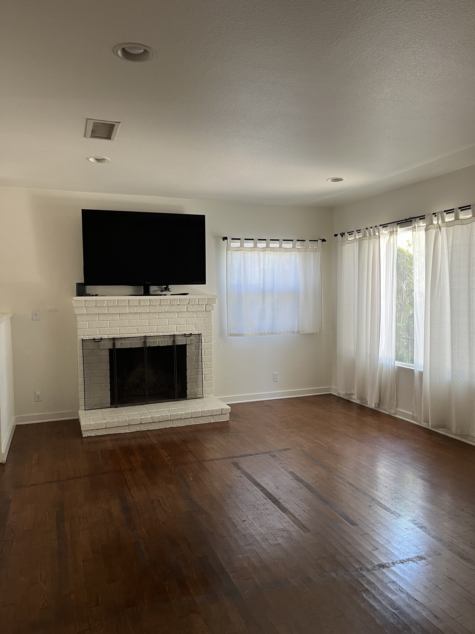 Livingroom has wood burning fireplace - 21050 Avenue San Luis