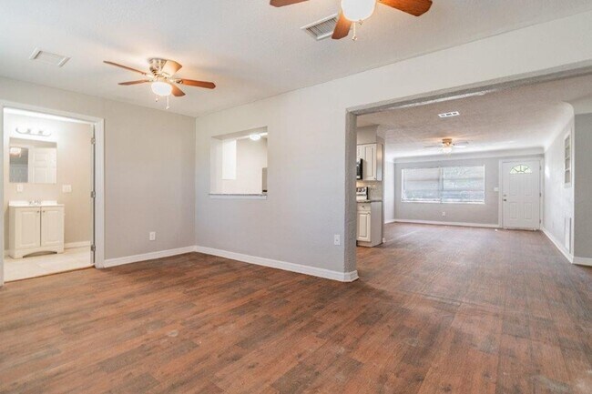 Building Photo - PRICE JUST REDUCED 3/2/1 1389 Sq. Ft. on a huge corner lot with granite & custom tile work!!