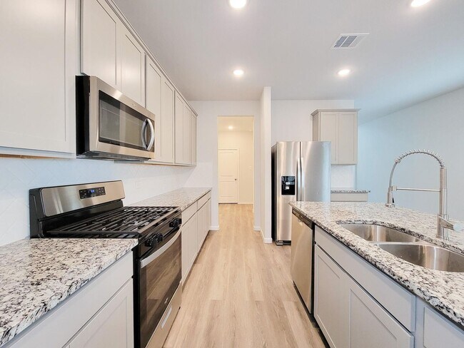 Building Photo - Welcome Home! Your never-lived-in sanctuary awaits your arrival. Have a large household? This 5-b...