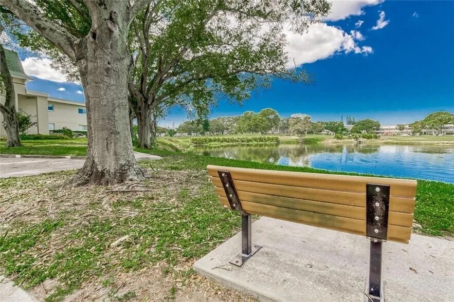 Beautiful pond with bench located down the road makes for a quiet reading place - 2460 Franciscan Dr