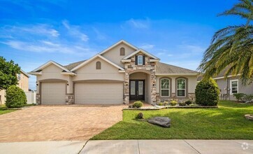 Building Photo - Luxurious 4/3.5 Modern Pool Home with a 3 ...