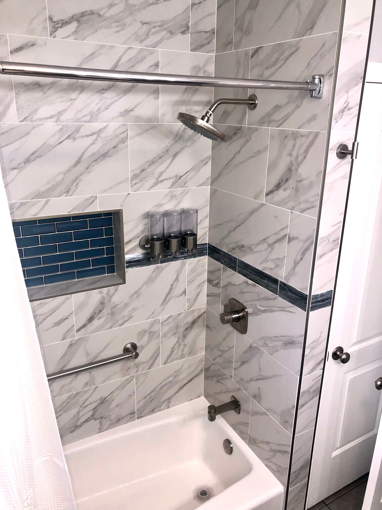 Well designed bath enclosure. - 771 56th St