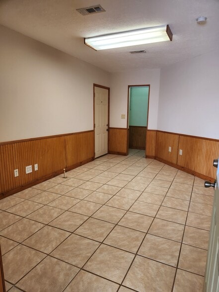 2nd bedroom, door to left opens to storage stall in barn - 5212 Bertsville Rd