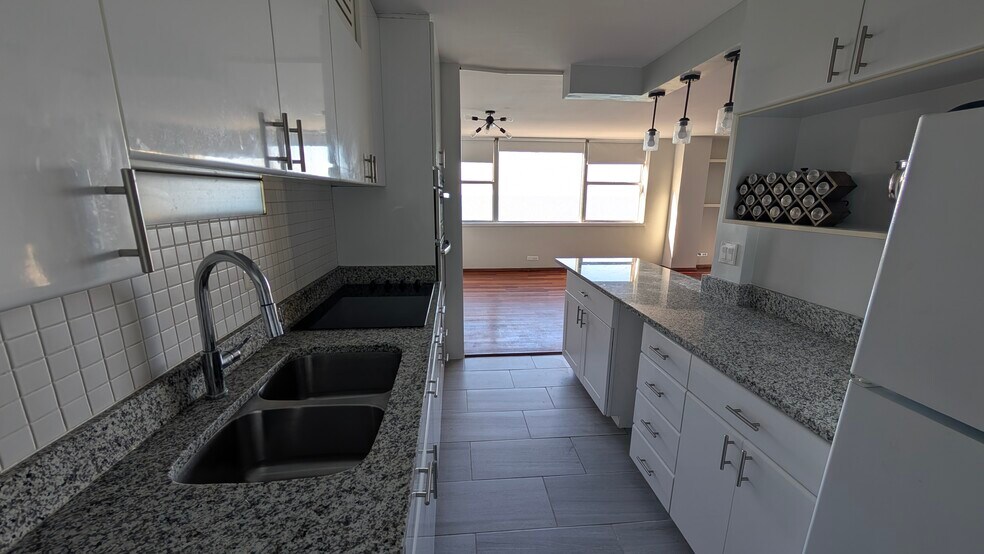 Kitchen and living/dining - 6301 N Sheridan Rd