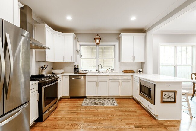 Building Photo - Beautiful Sylvan Park Home with Screened Porch & Outdoor Stone Fireplace