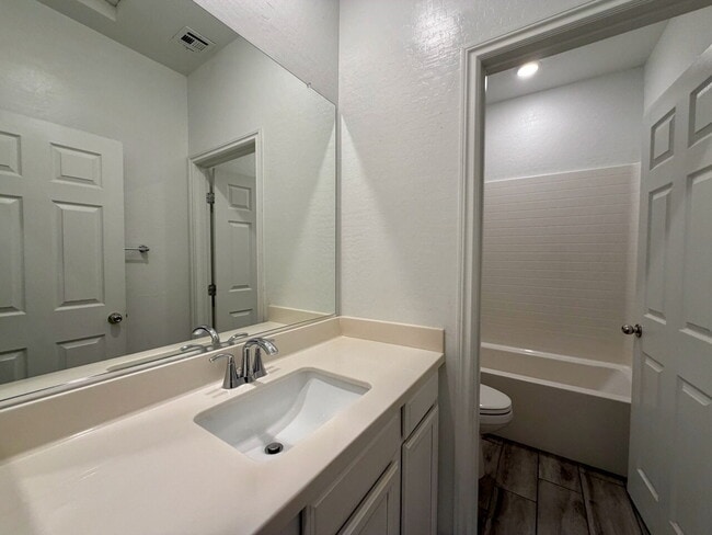 Building Photo - GATED 3 BED 2.5 BATH TOWNHOME WITH 2-CAR GARAGE, COVERED PATIO & COMMUNITY POOL