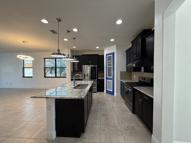 Building Photo - 4BR, 2.5BA home with resort style outdoor living!