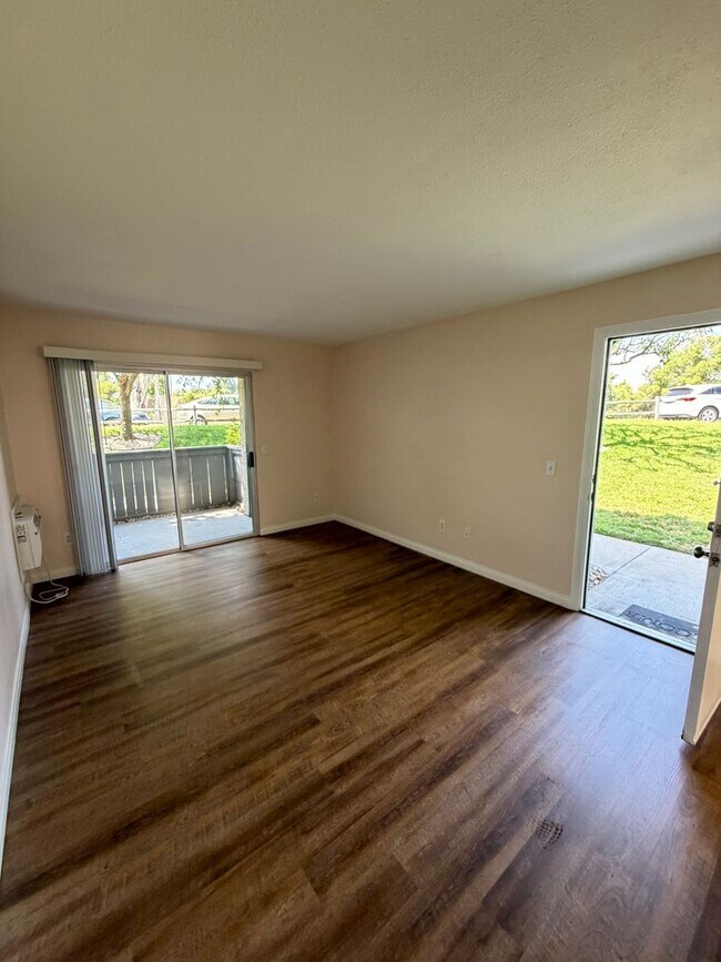 Building Photo - 2BR/1BA Lakeside ground floor condo with 1 car detached garage, 1 uncovered parking space & commu...