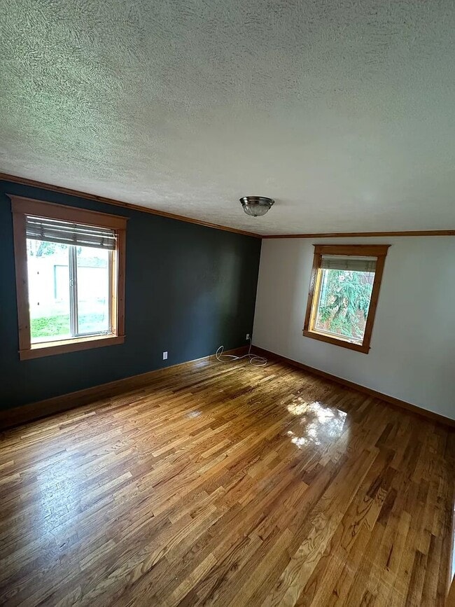 Building Photo - Ideally Located and Updated 4 Bed 2 Bath Fully-Fenced Home w/ Detached Garage/Shop!