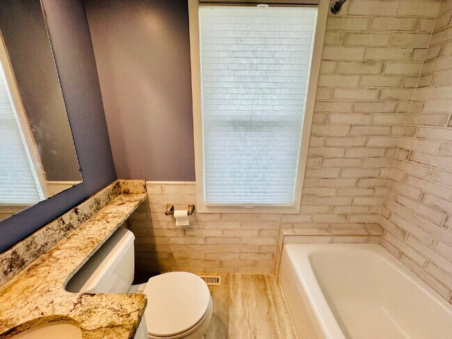 Building Photo - Charming 3-Bedroom Oasis with Elegant Touches & Finished Basement on Washburn Ave!