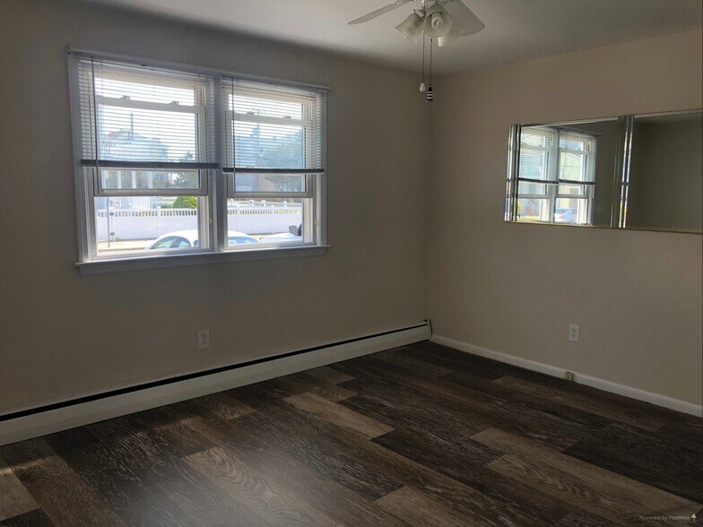 Living Area Showing Example of New LVP Flooring (Photo of downstairs unit with same layout) - 109 W Brigantine Ave