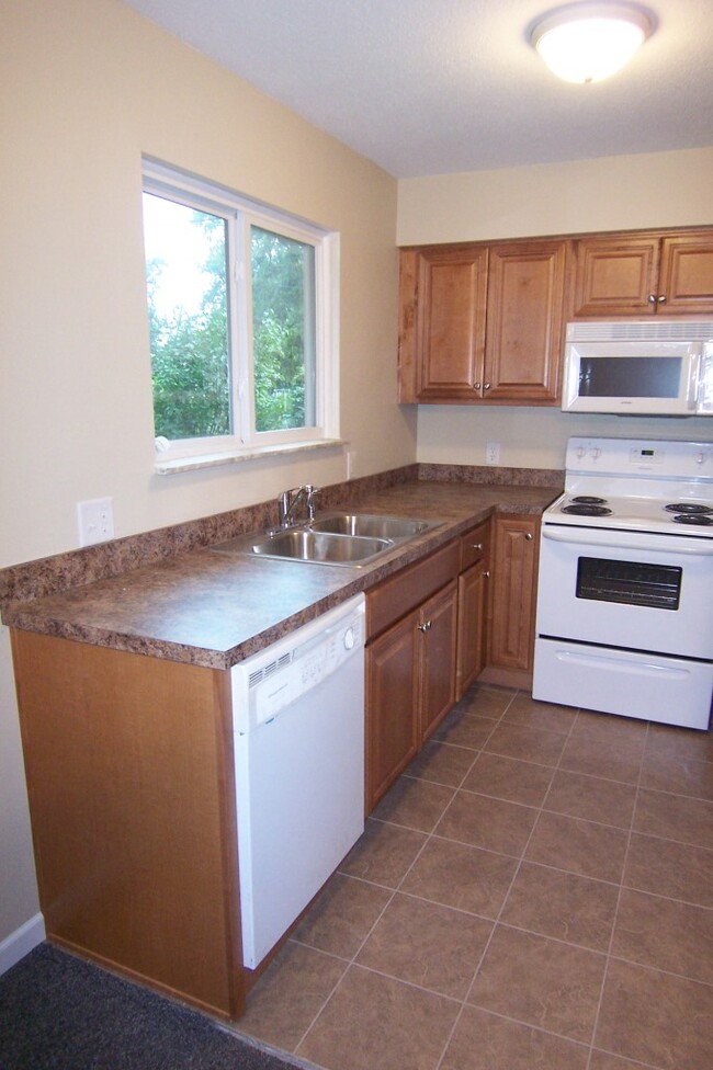 kitchen with new maple cabinets - 4773 Lorraine Ave