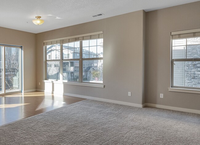 Building Photo - 2BR + 2.1BA Corner Townhome-Style Condo — Dual Primary Suites, Attached Garage & Most Utilities I...