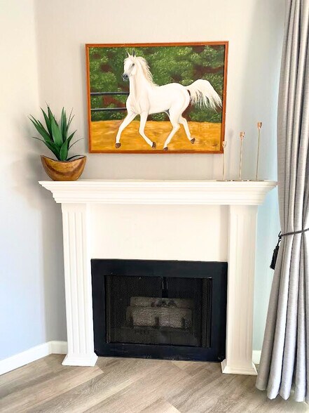 Gas Fireplace with white mantle. Feel free to decorate your space for the holidays! This is the per - 220 Woodland Pky
