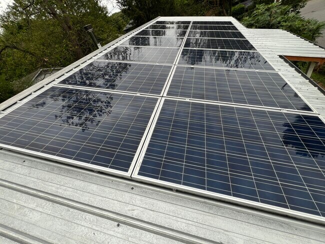 4,000 kW solar panel array on roof is net metered to significantly lower monthly bills - 73 Swannanoa Ave