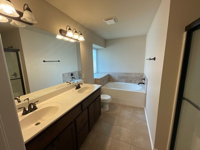 Building Photo - 4 bed, 2 bath, 2 car garage, 12-14 person Storm Shelter