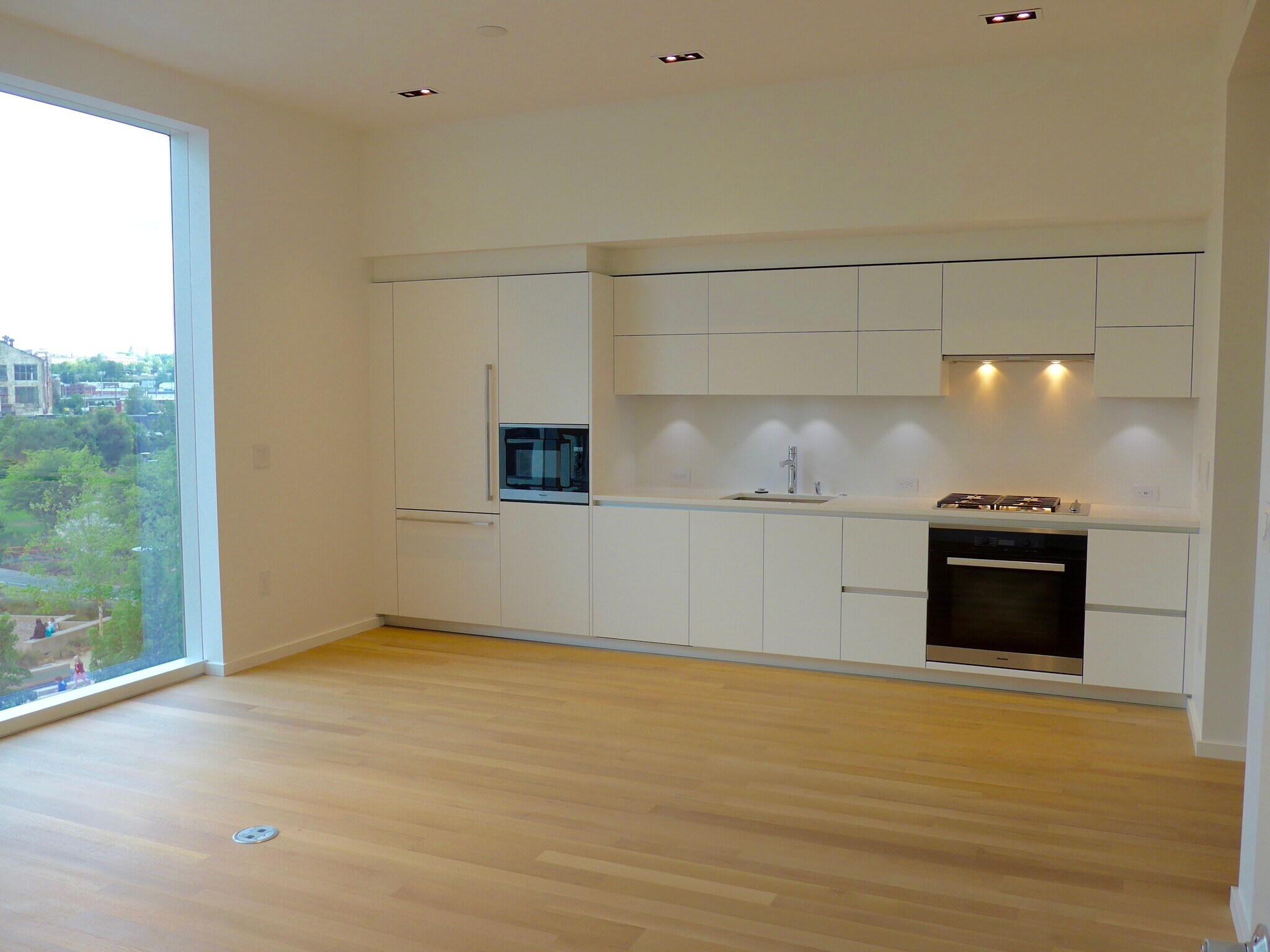 Large kitchen with Pedini cabinets, quartz countertops, and Miele appliances. - 1275 NW 10th Ave