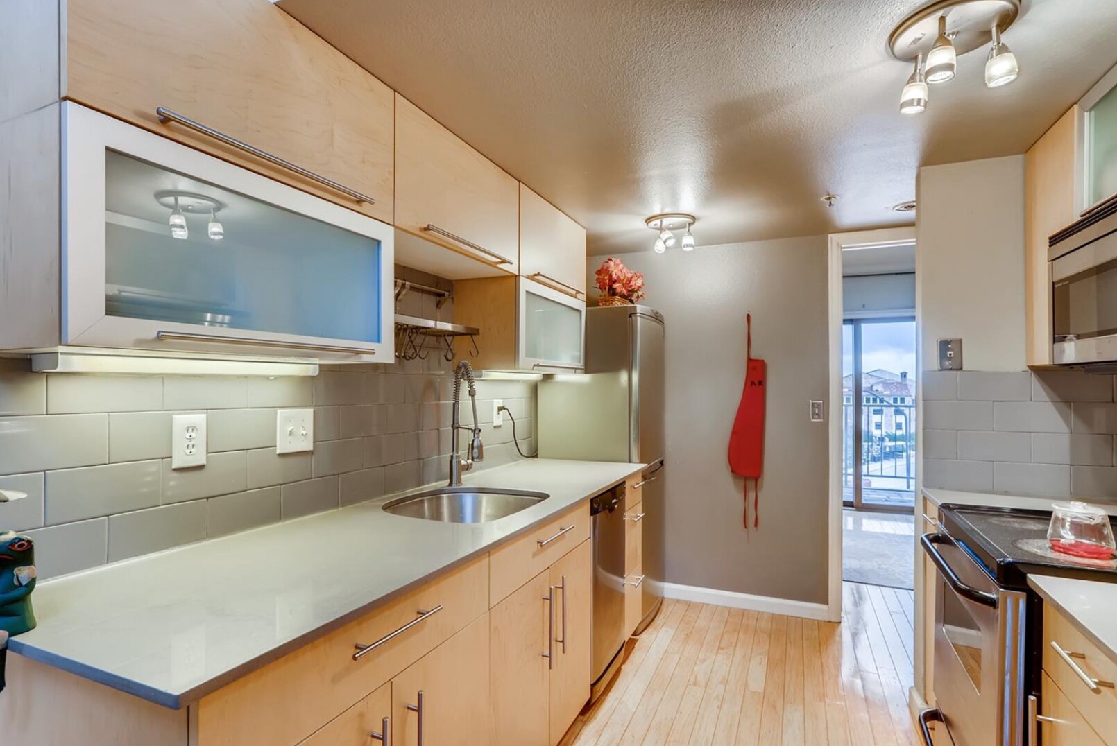 Kitchen with view towards main floor bedroom - 1085 Broadway St